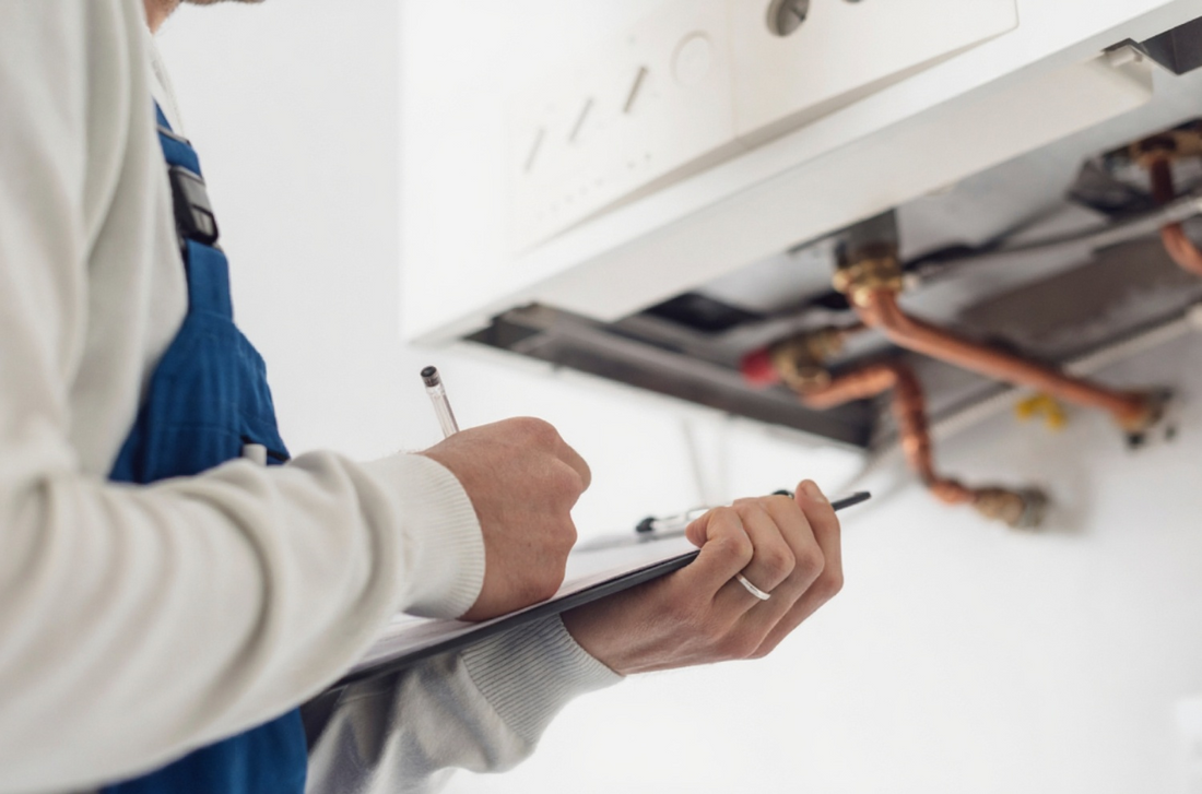 Plumber Performing a Pipe Inspection Process